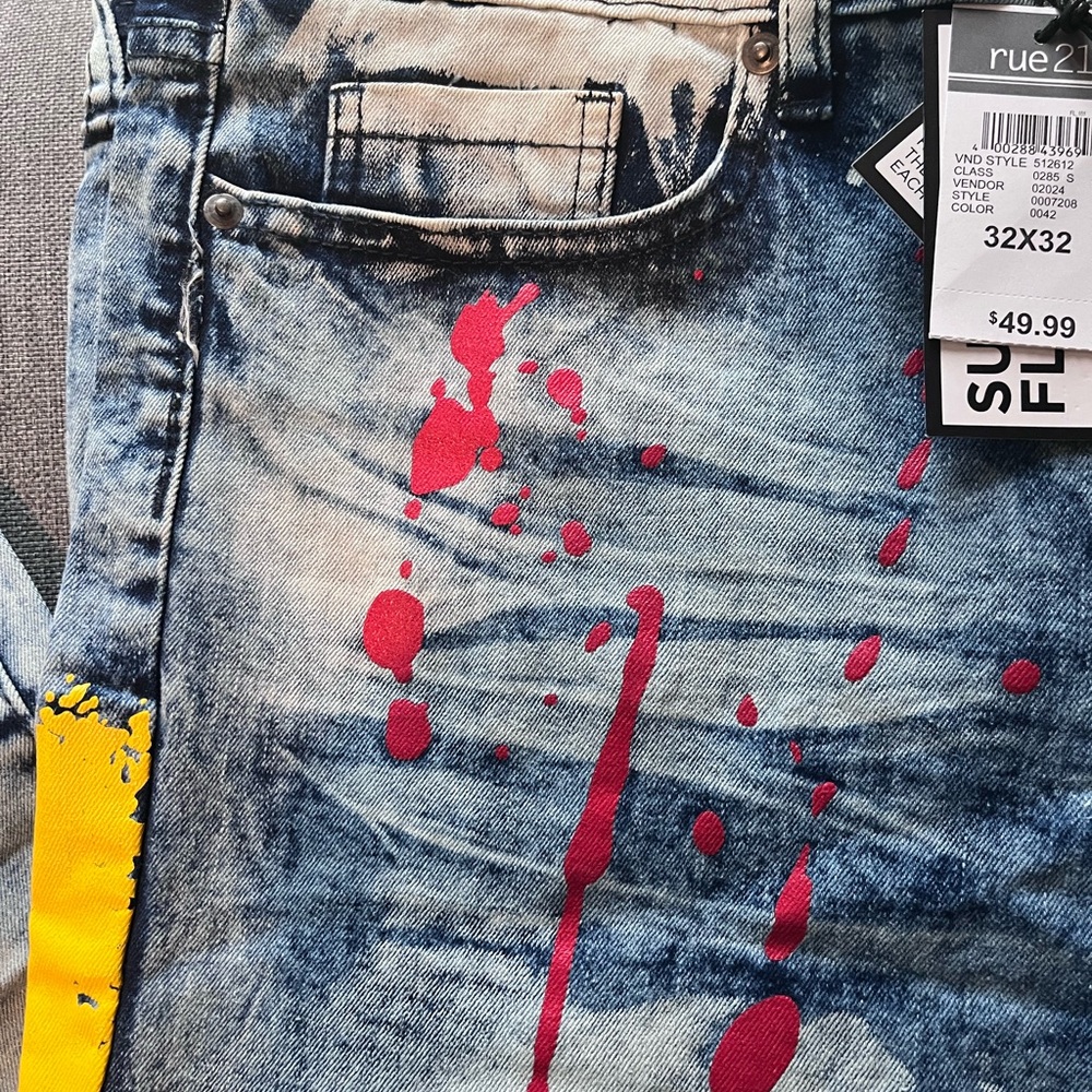 Rue21 Men's Distressed Blue Jeans with Red and Yellow Splashes